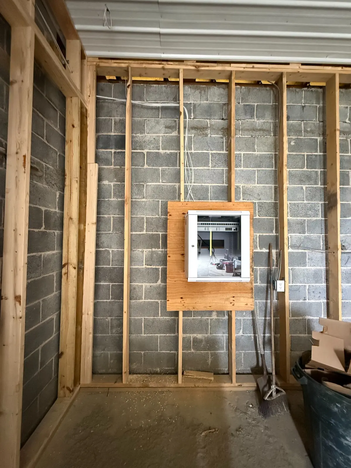 Wall-mount IDF cabinet installed during commercial construction rough-in